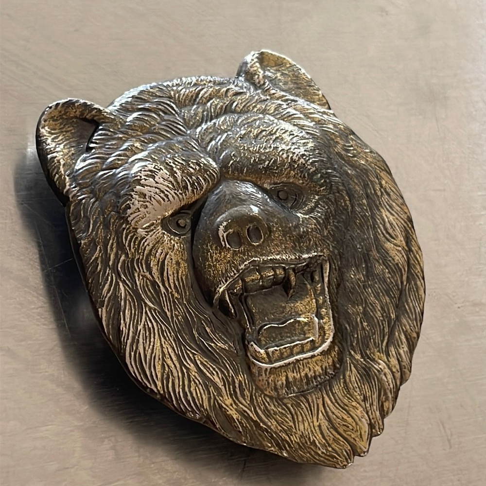 Dewey Miller 1980 brass bear head belt buckle. Stamped 483.